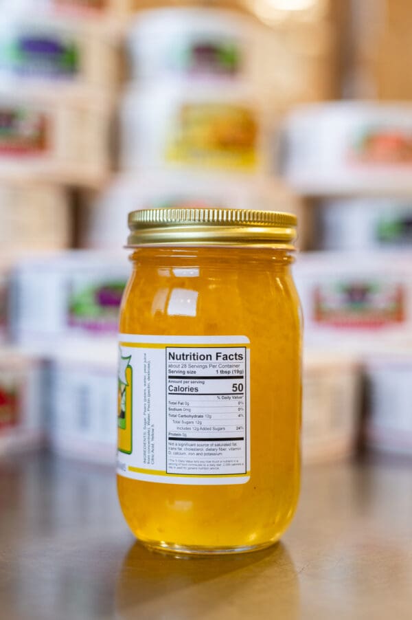 A jar of honey with the label on it.