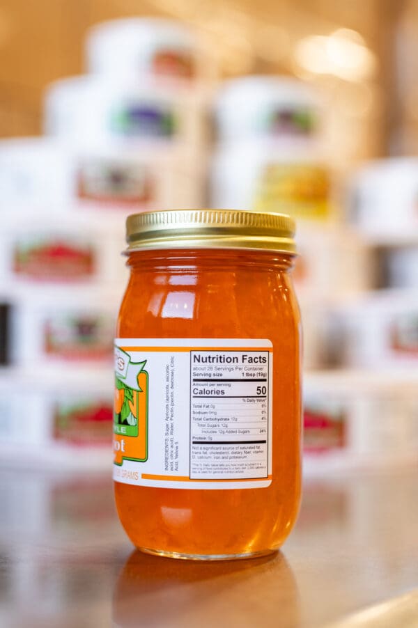 A jar of honey with the label on it.