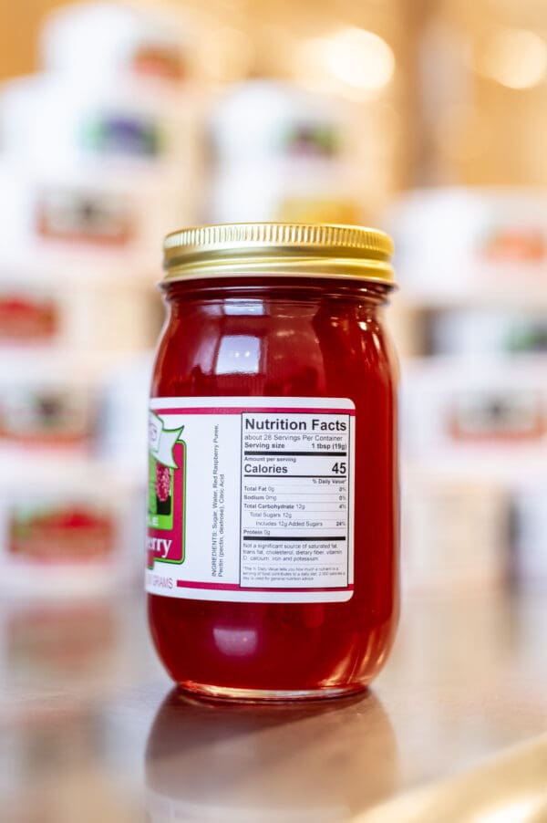 A jar of tomato sauce with the label on it.