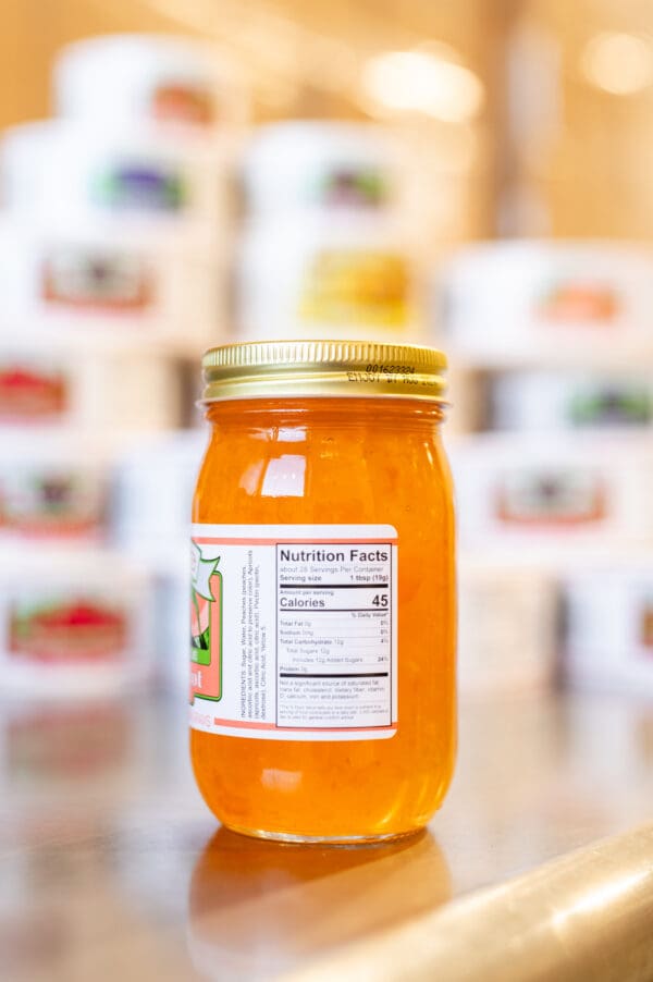 A jar of honey with a label on it.