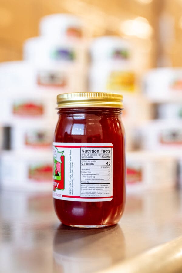 A jar of tomato sauce sitting on top of a table.