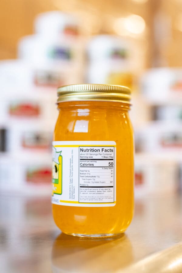 A jar of honey with the label on it.