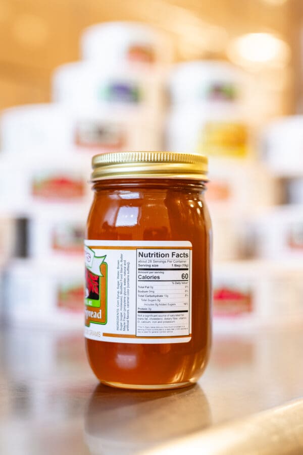 A jar of honey with a label on it.