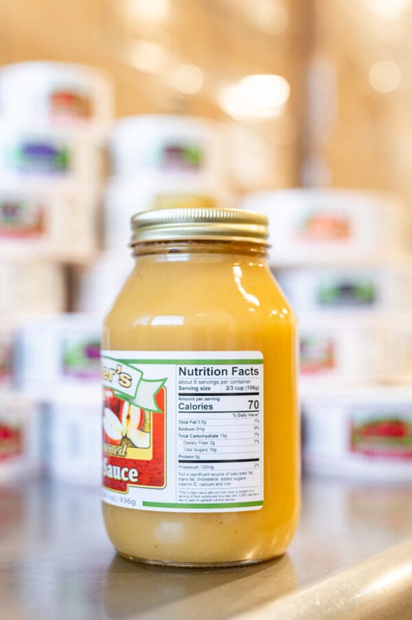 A jar of orange juice with the label on it.