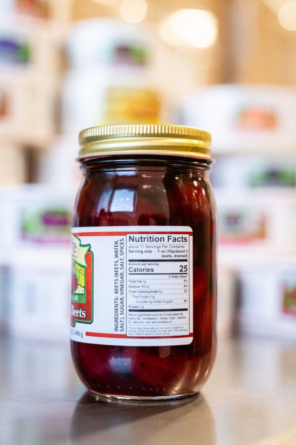 A jar of honey with a label on it.