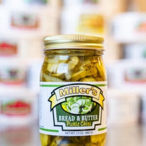 A jar of pickles sitting on top of a counter.