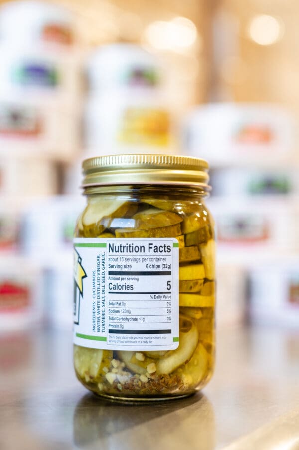 A jar of pickles with a nutrition label on it.