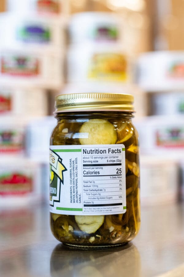 A jar of pickles with a nutrition label on it.