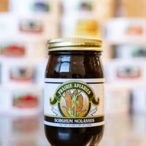 A jar of honey sitting on top of a table.