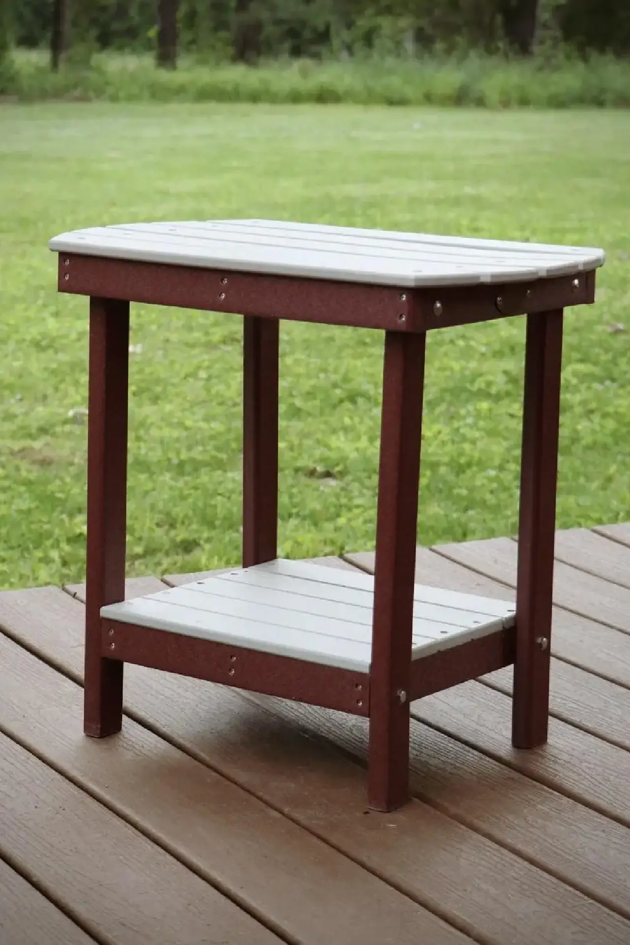 A table on the ground with grass in the background