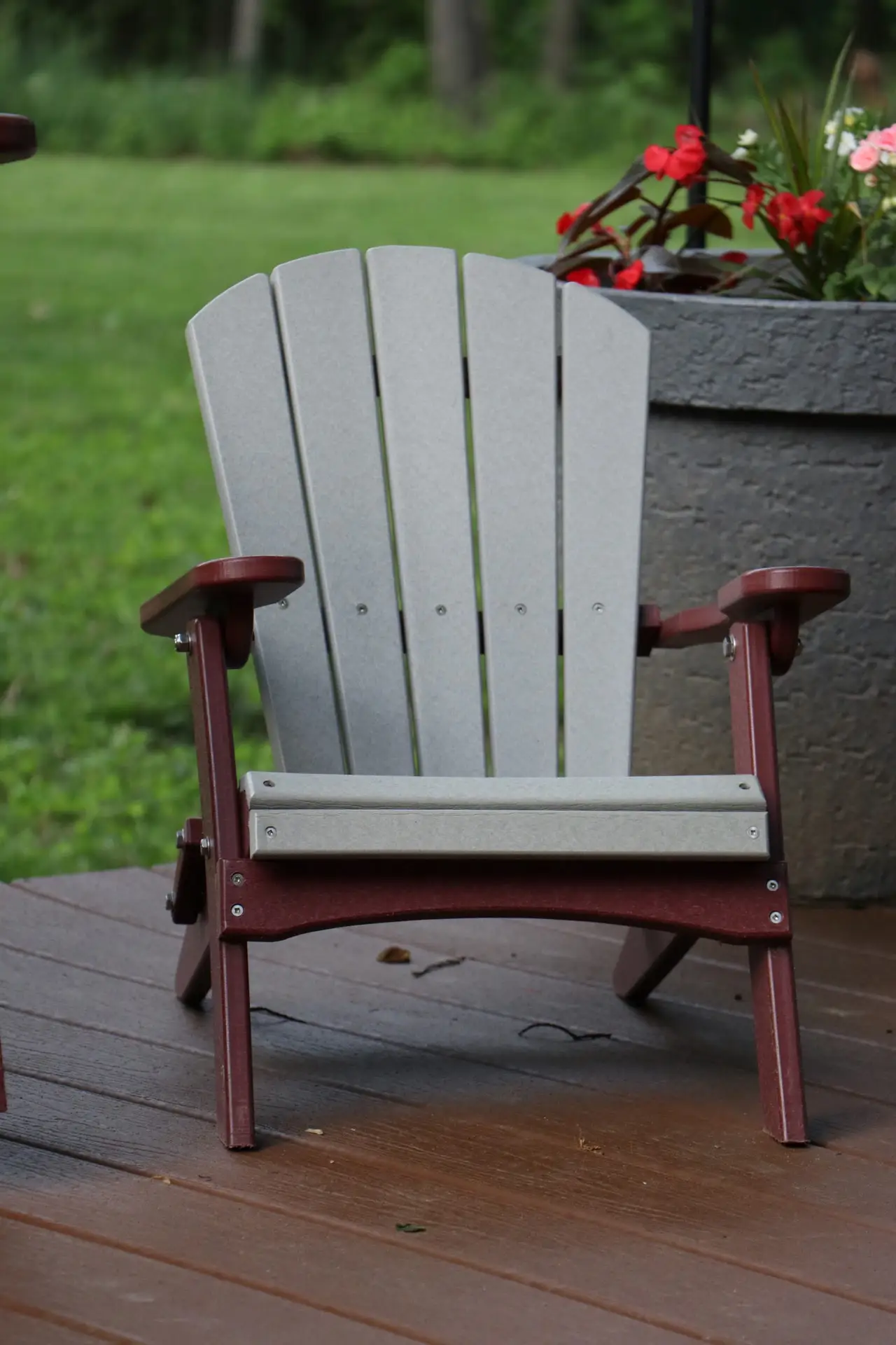 A white and red chair on the deck