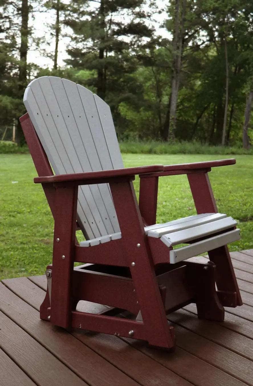 A red and white rocking chair on the deck