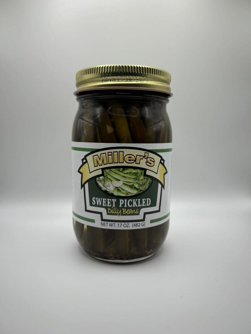 A jar of pickles sitting on top of a table.