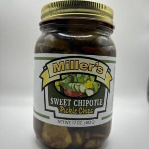 A jar of pickles sitting on top of a table.