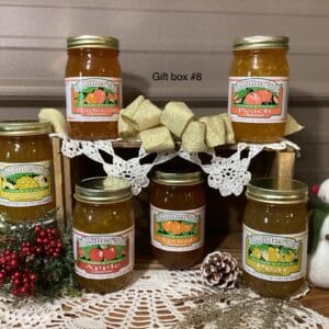 A set of six jars on top of a table.