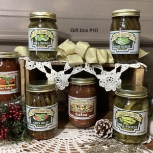 A table with jars of pickles and other condiments.